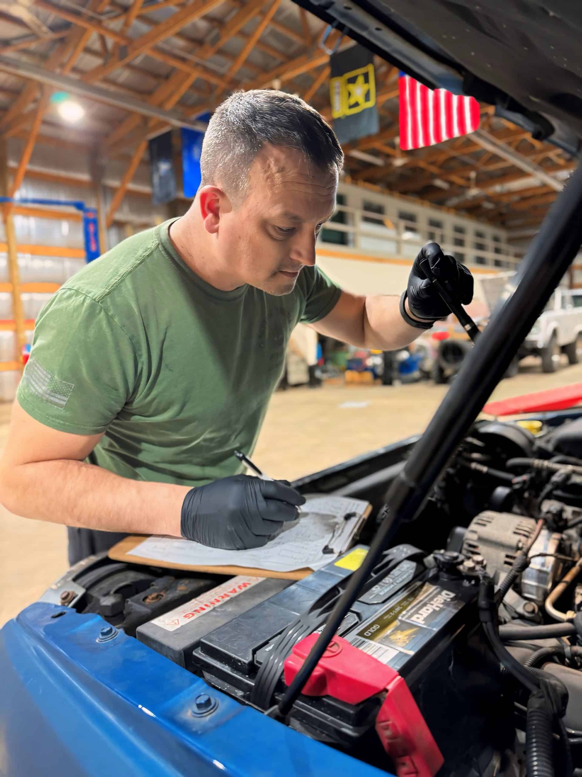 Mike diagnosing under the hood